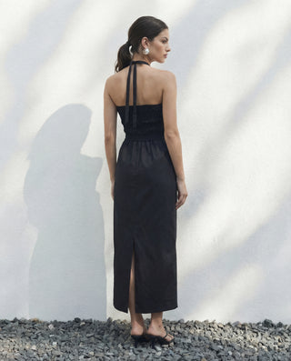 Back view of Sylvie halter dress in Black with shirred back